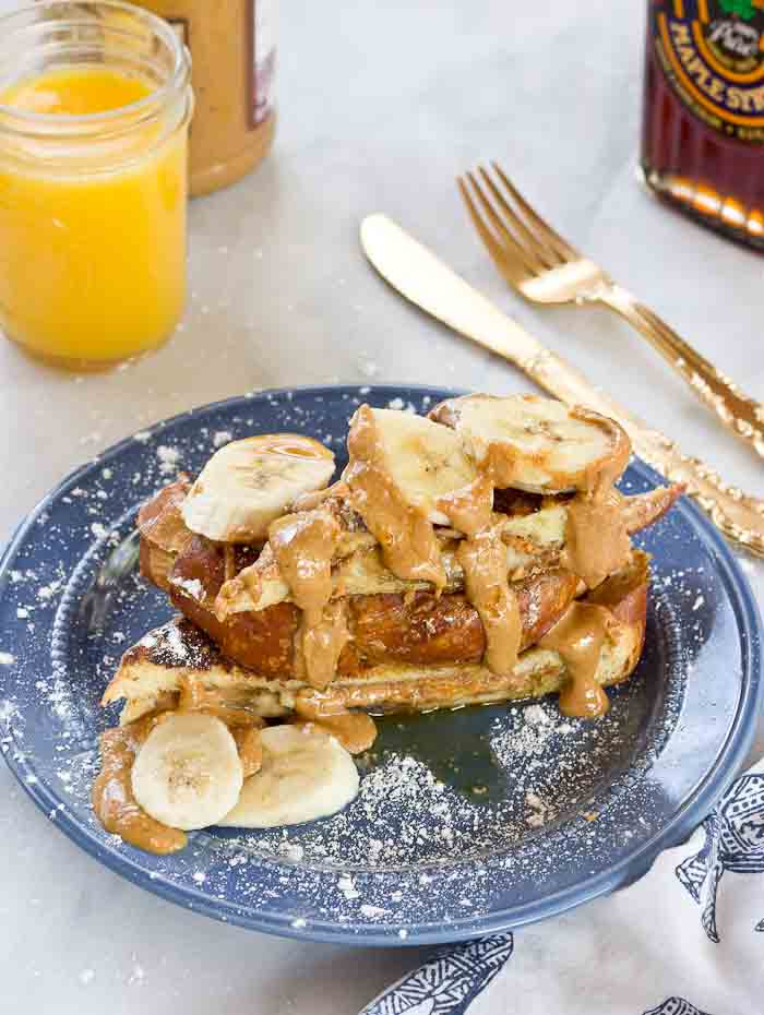 This Creamy Peanut Butter Banana Stuffed French toast is dabomb dot com. Like I'm so pumped about this flavor combo. Bring on the creamy PB and bananas please!