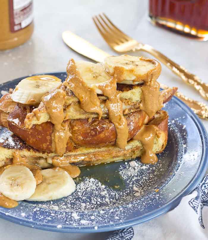 This Creamy Peanut Butter and Banana Stuffed French toast is dabomb dot com. Like I'm so pumped about this flavor combo. Bring on the creamy PB and bananas please!