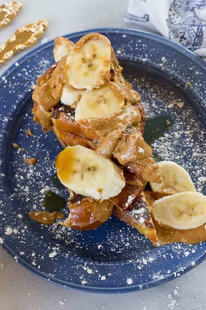 This Creamy Peanut Butter and Banana Stuffed French toast is dabomb dot com. Like I'm so pumped about this flavor combo. Bring on the creamy PB and bananas please!