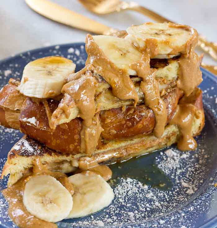 This Creamy Peanut Butter and Banana Stuffed French toast is dabomb dot com. Like I'm so pumped about this flavor combo. Bring on the creamy PB and bananas please!