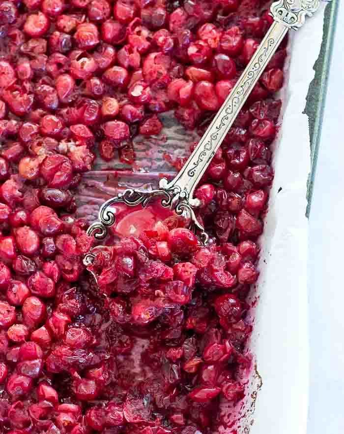 This Spiked Cranberry Chutney not only smells amazing while it's cooking, it’s so freaking good. Fresh cranberries, cinnamon, cloves and aged rum... the perfect topping for everything holiday!