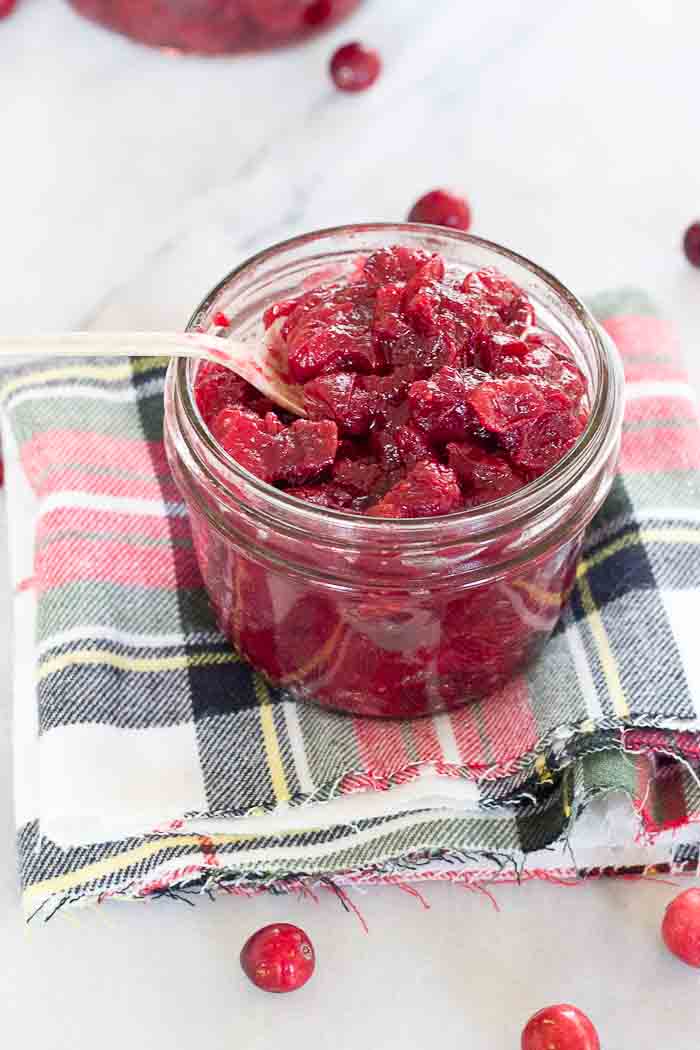 This Spiked Cranberry Chutney not only smells amazing while it's cooking, it’s so freaking good. Fresh cranberries, cinnamon, cloves and aged rum... the perfect topping for everything holiday!