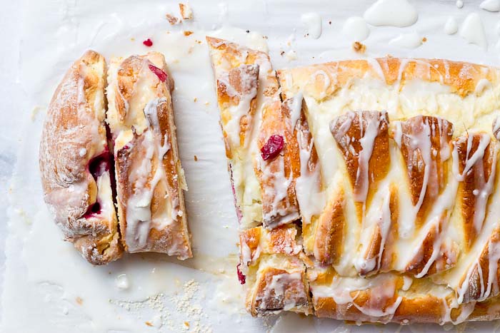 The flavors in this Cranberry Cream Cheese Braid are spot on and bursting with holiday freshness. Cranberries, cream cheese, and pillowy pastry dough...I’m like YIPPEEE! It’s the most wonderful time of the year.