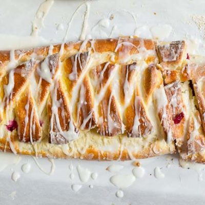 The flavors in this Cranberry Cream Cheese Braid are spot on and bursting with holiday freshness. Cranberries, cream cheese, and pillowy pastry dough...I’m like YIPPEEE! It’s the most wonderful time of the year.