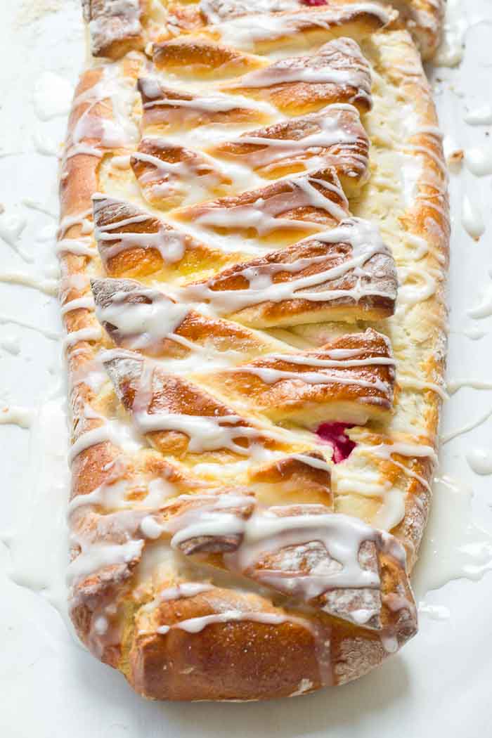 The flavors in this Cranberry Cream Cheese Braid are spot on and bursting with holiday freshness. Cranberries, cream cheese, and pillowy pastry dough...I’m like YIPPEEE! It’s the most wonderful time of the year.