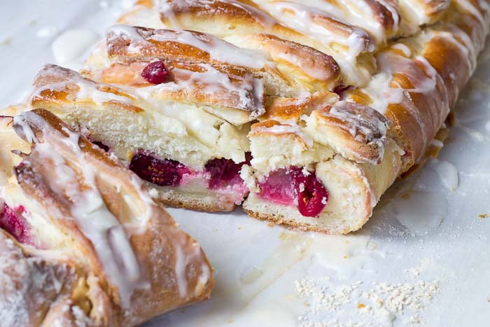 The flavors in this Cranberry Cream Cheese Braid are spot on and bursting with holiday freshness. Cranberries, cream cheese, and pillowy pastry dough...I’m like YIPPEEE! It’s the most wonderful time of the year.