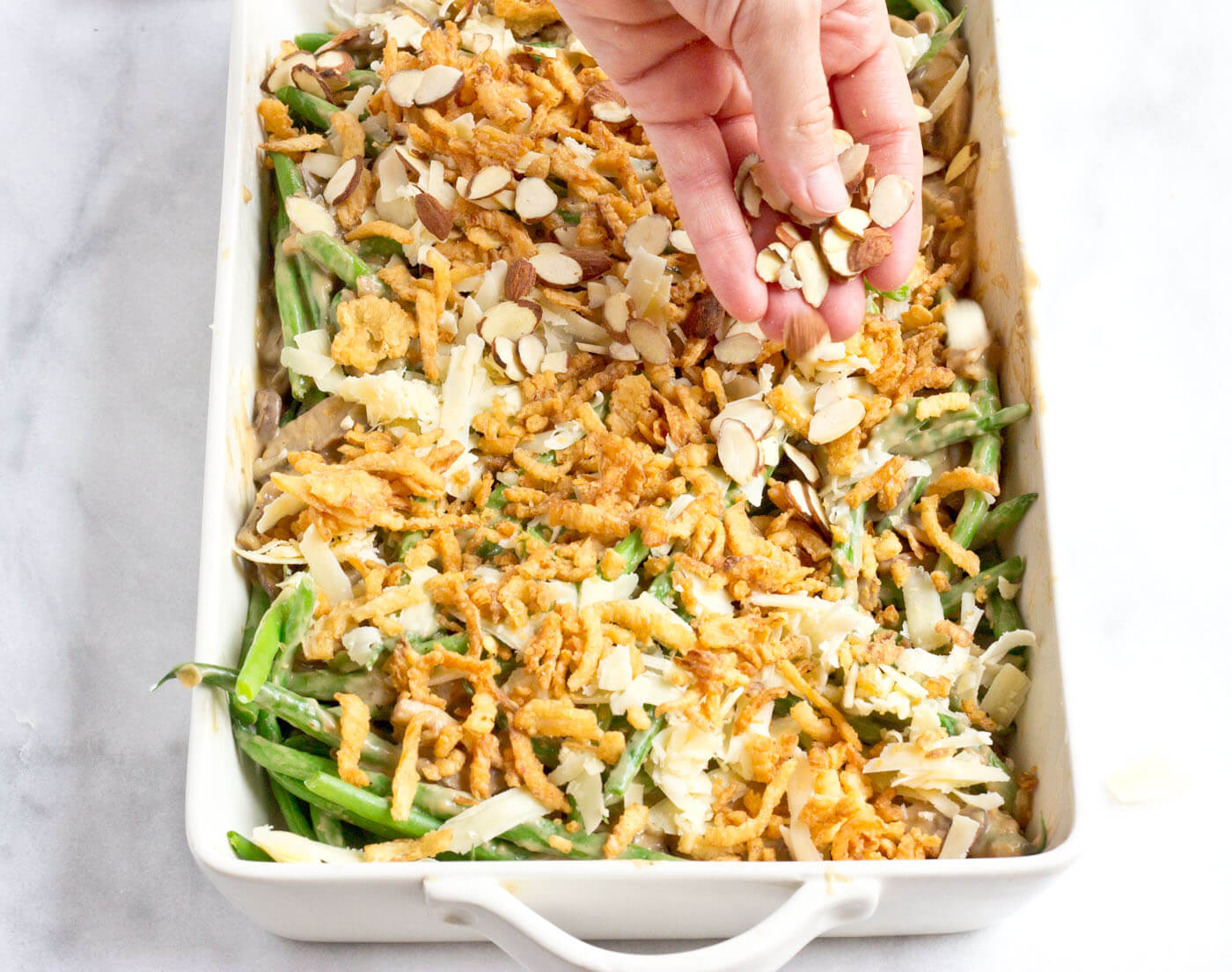 Because we all need Green Bean Casserole in our lives. This is recipe is easy and made with homemade cream of mushroom soup + au gratin topping! Extra crunchies, please!