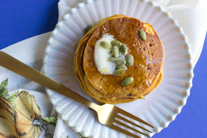 Okay so you want to know how to make restaurant style pancakes?! Use the CAST IRON SKILLET!! It will change your pancake life. Helloooo beautiful stack of Gluten Free Pumpkin Pancakes, my fork is coming for you.