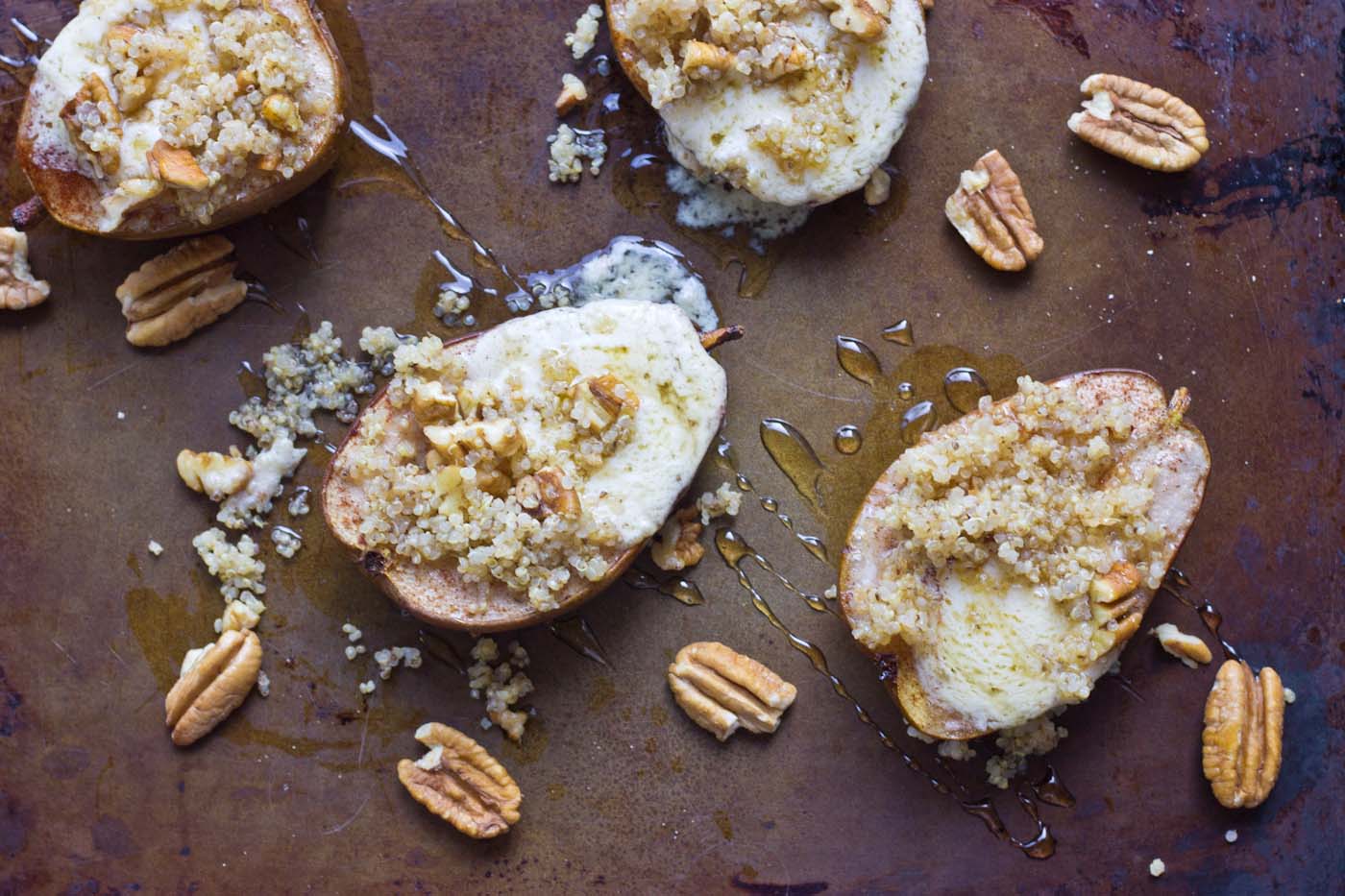 Roasted Quinoa Stuffed Pears are exactly what I want to eat on a cool morning this fall. These pears are stuffed with mascarpone cheese, quinoa, and pecans. So yum!