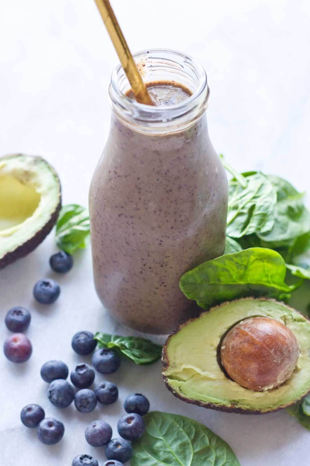 This Tropical Superfood Smoothie is so energizing! A blend of fresh spinach, blueberries, avocado, banana, and pineapple in one glass! 