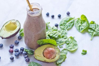 This Tropical Superfood Smoothie is so energizing! A blend of fresh spinach, blueberries, avocado, banana, and pineapple in one glass!