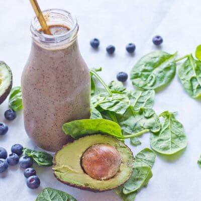 This Tropical Superfood Smoothie is so energizing! A blend of fresh spinach, blueberries, avocado, banana, and pineapple in one glass!