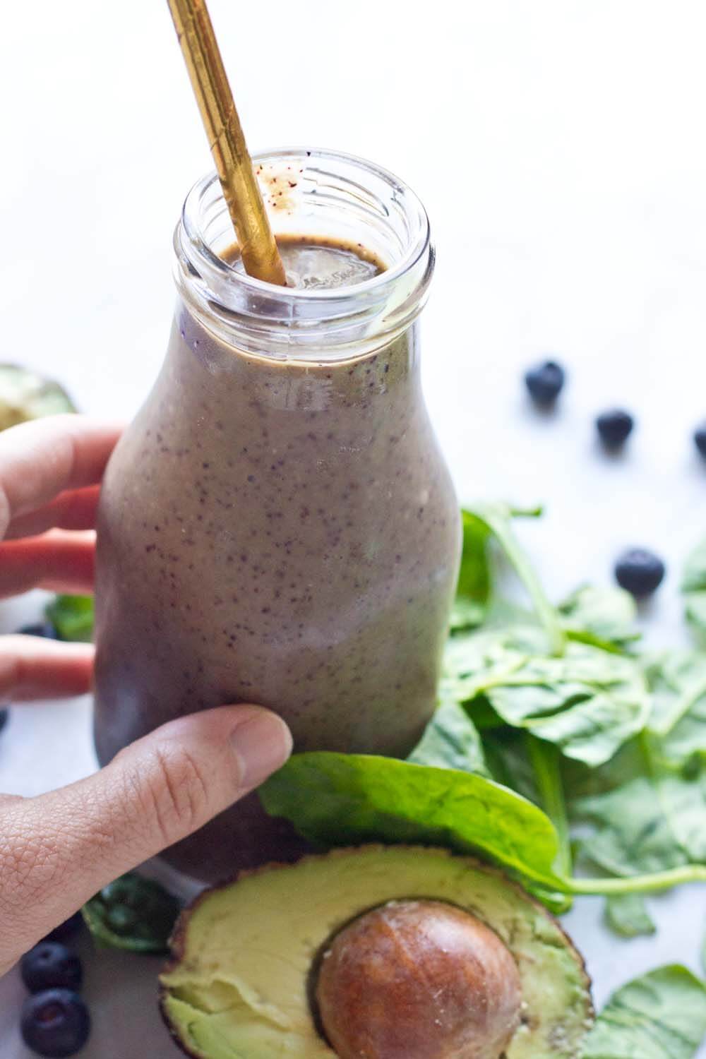 This Tropical Superfood Smoothie is so energizing! A blend of fresh spinach, blueberries, avocado, banana, and pineapple in one glass! 