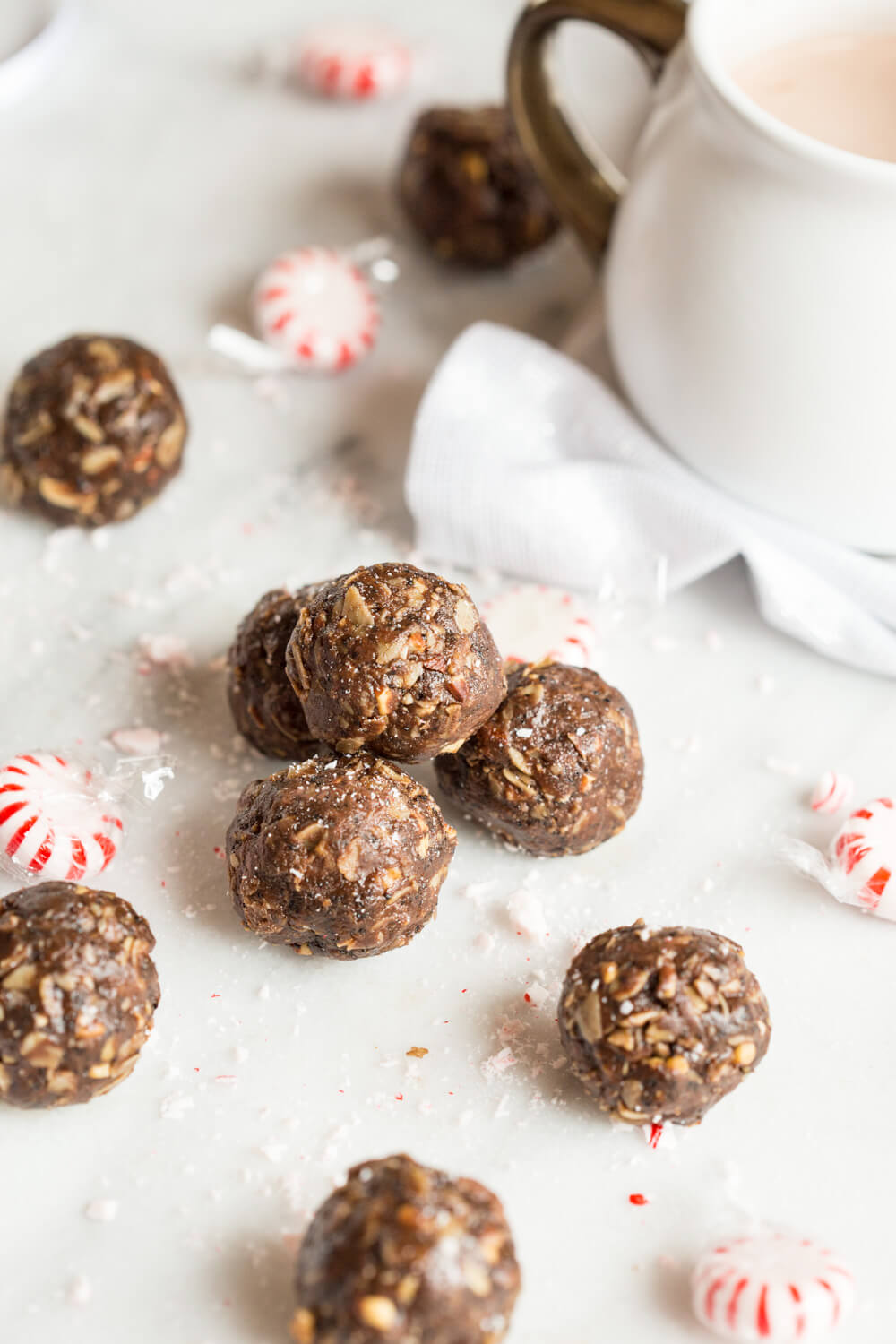 These Peppermint Mocha Energy Bites made with almond butter, oats, and ground coffee are sooo easy to prepare-- all you need is a big bowl and mixing spoon. They make the perfect snack for traveling during the holidays!