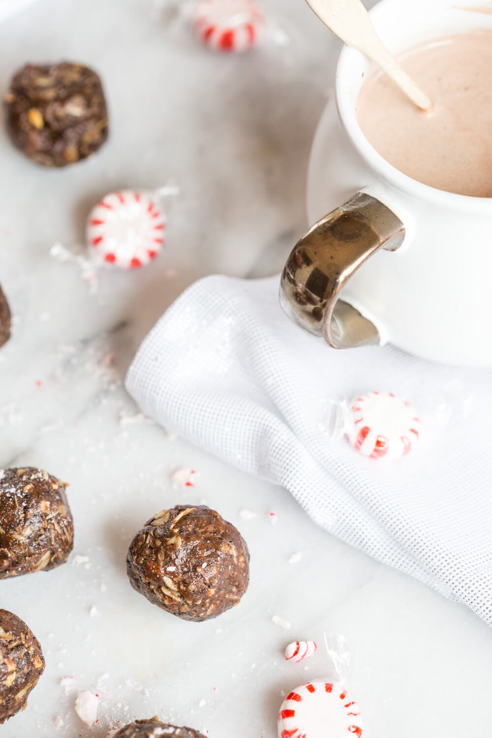 These Peppermint Mocha Energy Bites made with almond butter, oats, and ground coffee are sooo easy to prepare-- all you need is a big bowl and mixing spoon. They make the perfect snack for traveling during the holidays!