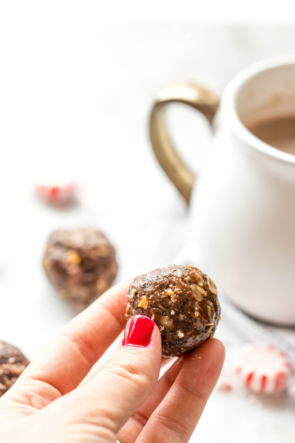 These Peppermint Mocha Energy Bites made with almond butter, oats, and ground coffee are sooo easy to prepare-- all you need is a big bowl and mixing spoon. They make the perfect snack for traveling during the holidays!