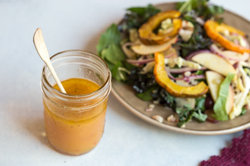 This Winter Greens Salad with Citrus Vinaigrette tho. It's exactly what should be on your holiday table--- warm acorn squash, apple slaw, winter greens, hearty grains and a tangy citrus vinaigrette! Add grilled chicken or garbanzo beans to make this salad a meal, or serve as a salad in your holiday spread.