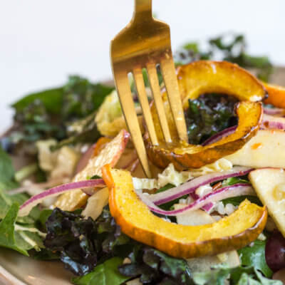 This Winter Greens Salad with Citrus Vinaigrette tho. It's exactly what should be on your holiday table--- warm acorn squash, apple slaw, winter greens, hearty grains and a tangy citrus vinaigrette! Add grilled chicken or garbanzo beans to make this salad a meal, or serve as a salad in your holiday spread.