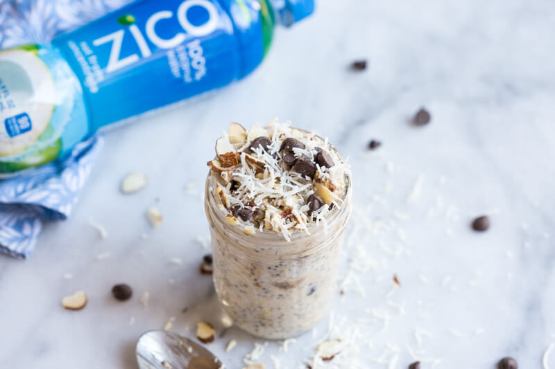 Almond Joy Overnight Oats made with coconut water.... say what??!! Yep, healthy dessert for breakfast... NO ADDED SUGAR and dairy free (well, minus the chocolate on top...but gimmeee all dat chocolate!)
