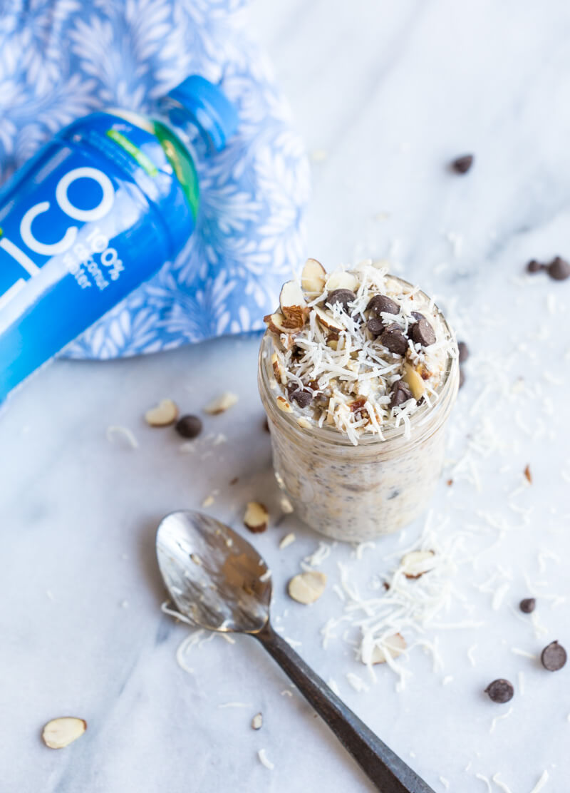 Almond Joy Overnight Oats made with coconut water.... say what??!! Yep, healthy dessert for breakfast... NO ADDED SUGAR and dairy free (well, minus the chocolate on top...but gimmeee all dat chocolate!)