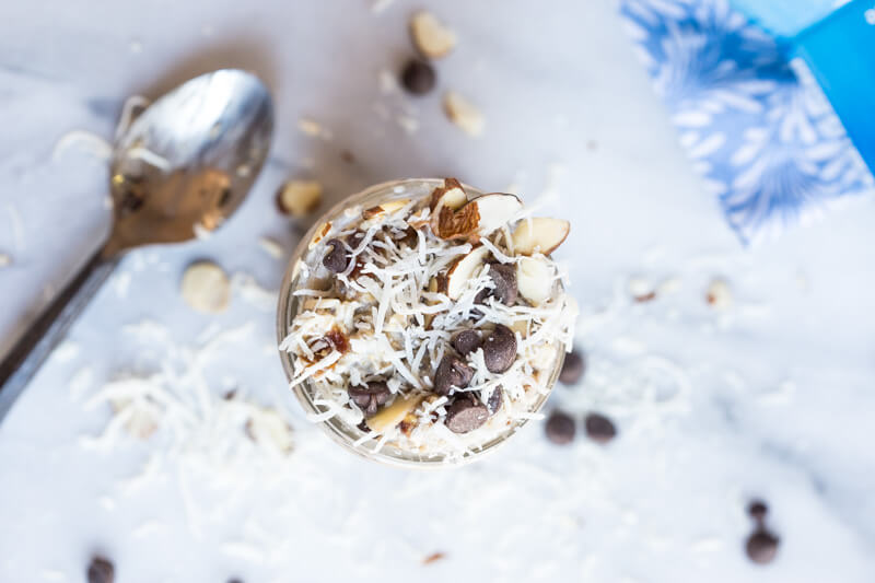 Almond Joy Overnight Oats made with coconut water.... say what??!! Yep, healthy dessert for breakfast... NO ADDED SUGAR and dairy free (well, minus the chocolate on top...but gimmeee all dat chocolate!)