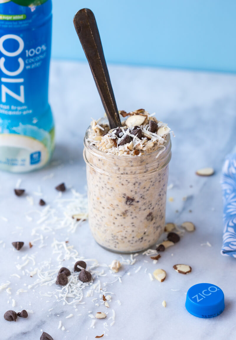 Almond Joy Overnight Oats made with coconut water.... say what??!! Yep, healthy dessert for breakfast... NO ADDED SUGAR and dairy free (well, minus the chocolate on top...but gimmeee all dat chocolate!)