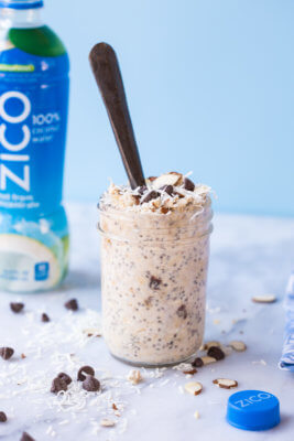 Almond Joy Overnight Oats made with coconut water.... say what??!! Yep, healthy dessert for breakfast... NO ADDED SUGAR and dairy free (well, minus the chocolate on top...but gimmeee all dat chocolate!)