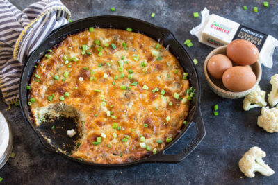 This Cauliflower Breakfast Skillet Casserole is protein packed thanks to chicken sausage, eggs and cheese. LOVE this savory lower carb breakfast-- I'm looking at you cauliflower! Meal prep at the beginning of the week and store slices in airtight containers for a convenient breakfast on the go!