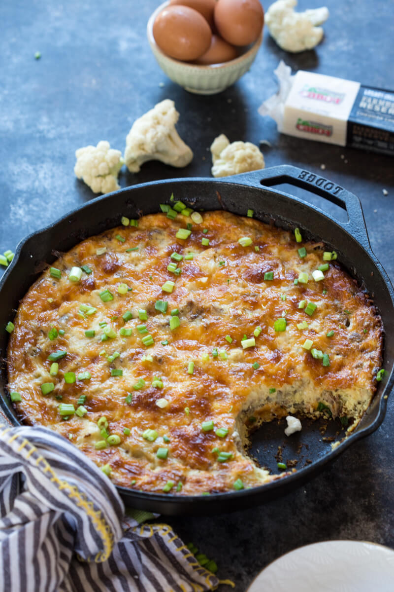 This Cauliflower Breakfast Skillet Casserole is protein packed thanks to chicken sausage, eggs and cheese. LOVE this savory lower carb breakfast-- I'm looking at you cauliflower! Meal prep at the beginning of the week and store slices in airtight containers for a convenient breakfast on the go! 