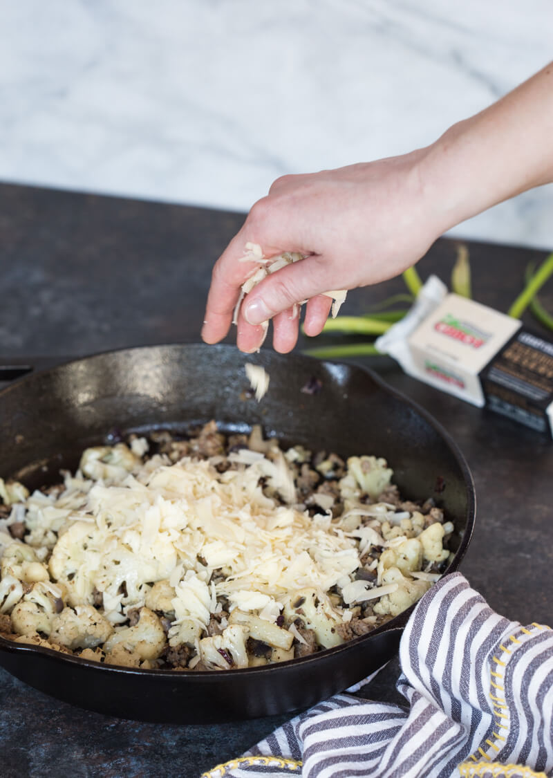 This Cauliflower Breakfast Skillet Casserole is protein packed thanks to chicken sausage, eggs and Cabot cheese. LOVE this savory lower carb breakfast-- I'm looking at you cauliflower! Meal prep this recipe at the beginning of the week and store slices in airtight containers for a convenient breakfast on the go! 