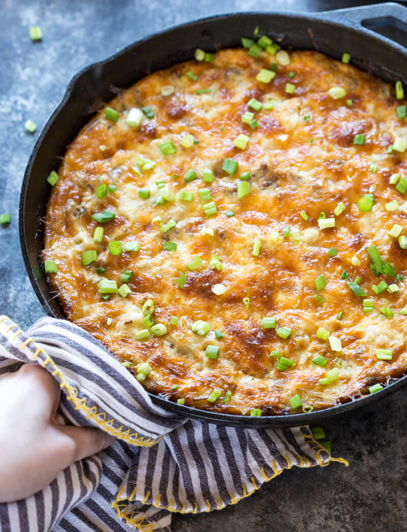 This Cauliflower Breakfast Skillet Casserole is protein packed thanks to chicken sausage, eggs and cheese. LOVE this savory lower carb breakfast-- I'm looking at you cauliflower! Meal prep at the beginning of the week and store slices in airtight containers for a convenient breakfast on the go! 