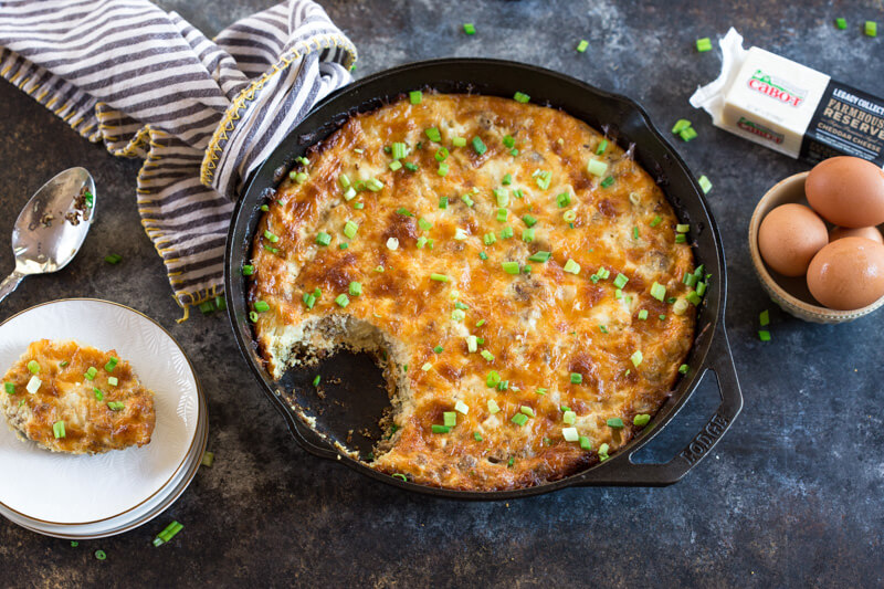 This Cauliflower Breakfast Skillet Casserole is protein packed thanks to chicken sausage, eggs and Cabot cheese. LOVE this savory lower carb breakfast-- I'm looking at you cauliflower! Meal prep this recipe at the beginning of the week and store slices in airtight containers for a convenient breakfast on the go! 