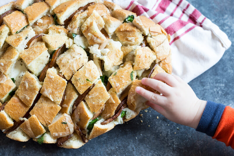 This Cheesy Pull Apart Bread will serve a crowd or simply scale the recipe down for one or two. It's easy to make and tastes delicious with soup!