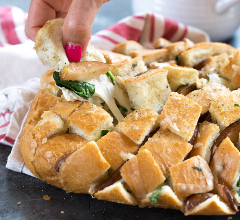 This Cheesy Pull Apart Bread will serve a crowd or simply scale the recipe down for one or two. It's easy to make and tastes delicious with soup!