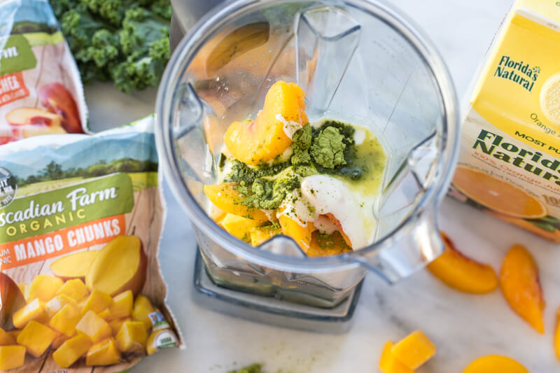 Go green with this mighty Matcha Green Tea Smoothie made with frozen mango, peaches, kale, orange juice, kefir, and matcha green tea powder. It's antioxidant rich, smooth and creamy and makes a great breakfast or snack!