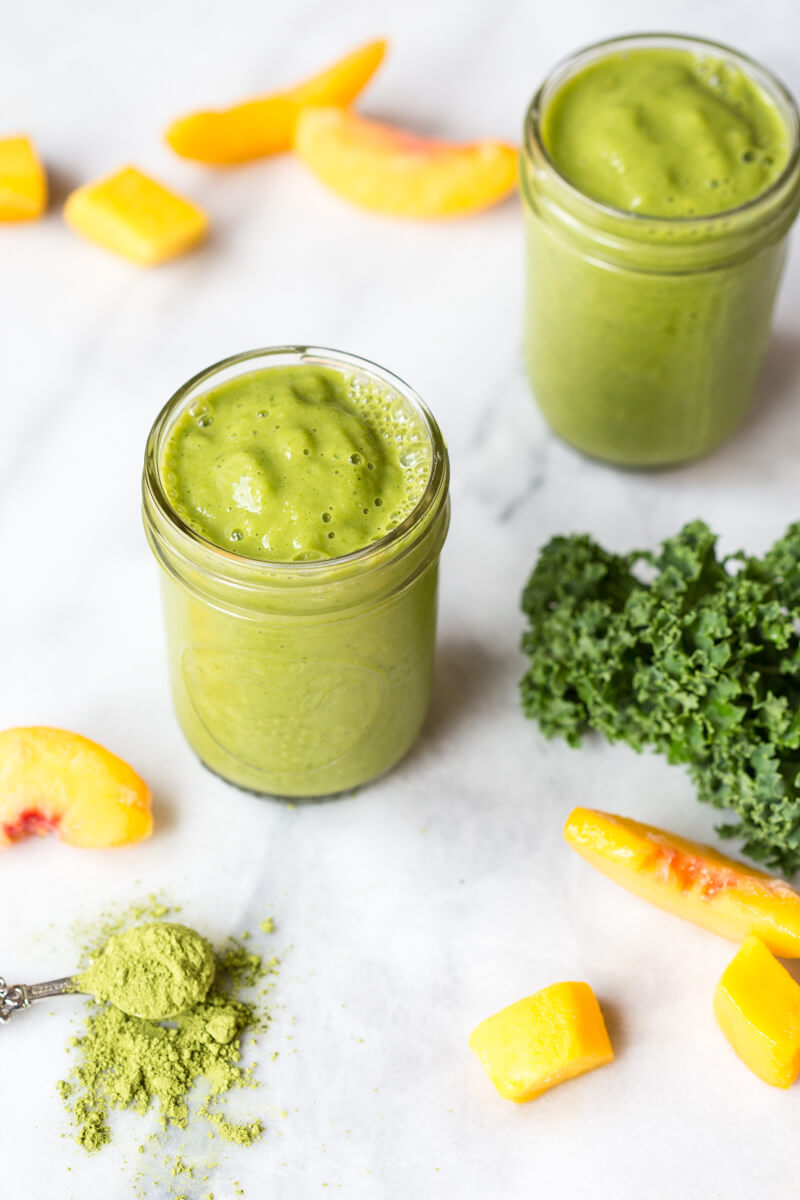 Go green with this mighty Matcha Green Tea Smoothie made with frozen mango, peaches, kale, orange juice, kefir, and matcha green tea powder. It's antioxidant rich, smooth and creamy and makes a great breakfast or snack!