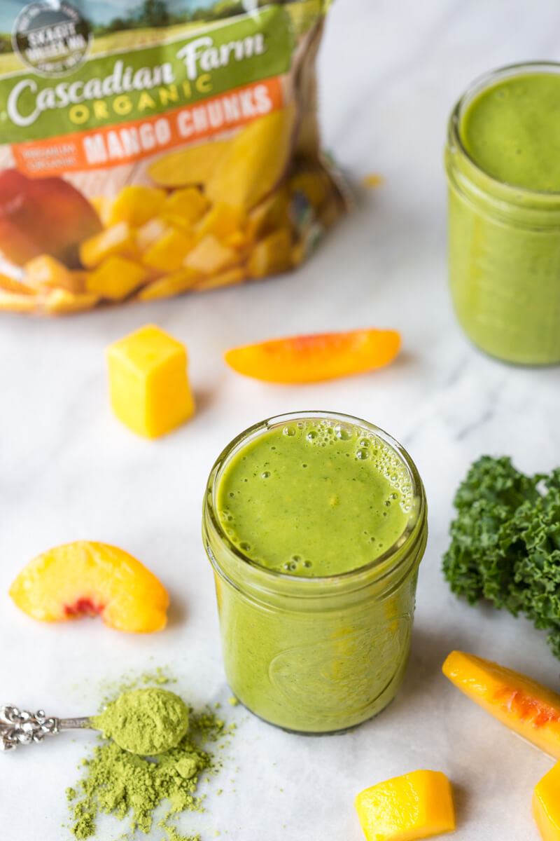 Go green with this mighty Matcha Green Tea Smoothie made with frozen mango, peaches, kale, orange juice, kefir, and matcha green tea powder. It's antioxidant rich, smooth and creamy and makes a great breakfast or snack!