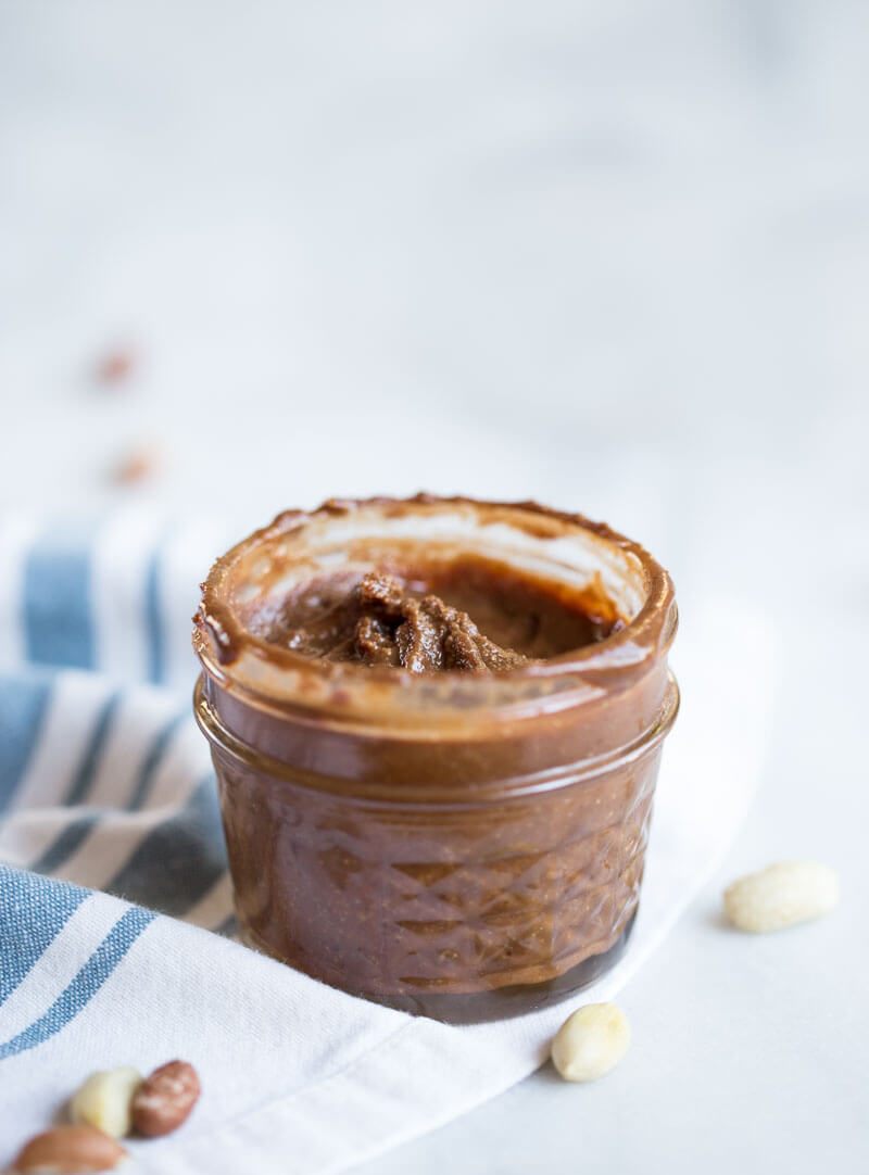 Homemade Chocolate Peanut Butter.... that's actually good for you and made with no added sugar. If you've ever wondered if you can make peanut butter at home, get excited because the answer is YES!! And chocolate is involved.