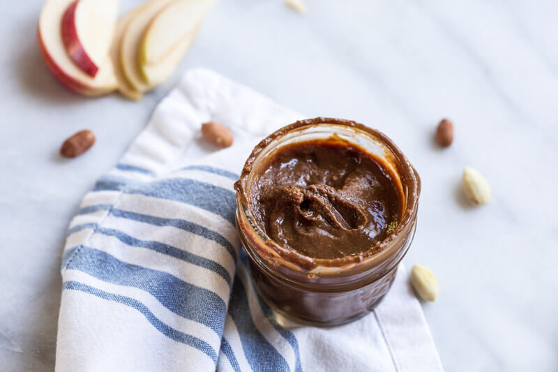 Homemade Chocolate Peanut Butter.... that's actually good for you and made with no added sugar. If you've ever wondered if you can make peanut butter at home, get excited because the answer is YES!! And chocolate is involved.