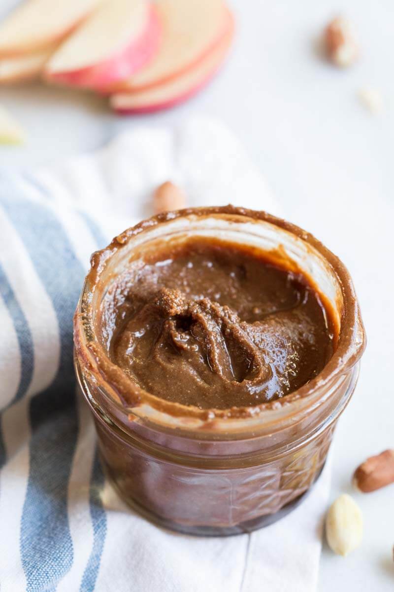 Homemade Chocolate Peanut Butter.... that's actually good for you and made with no added sugar. If you've ever wondered if you can make peanut butter at home, get excited because the answer is YES!! And chocolate is involved.