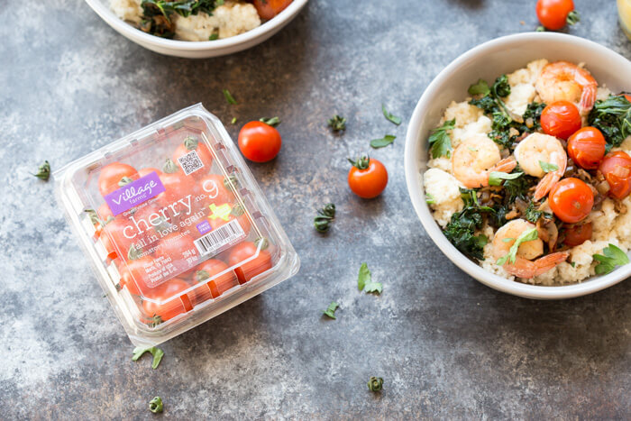 Shrimp and Cheesy Cauliflower Grits, a low carb southern breakfast. Cheesy cauliflower grits topped with savory shrimp, bacon, a hearty dose of kale, and blistered cherry tomatoes. 