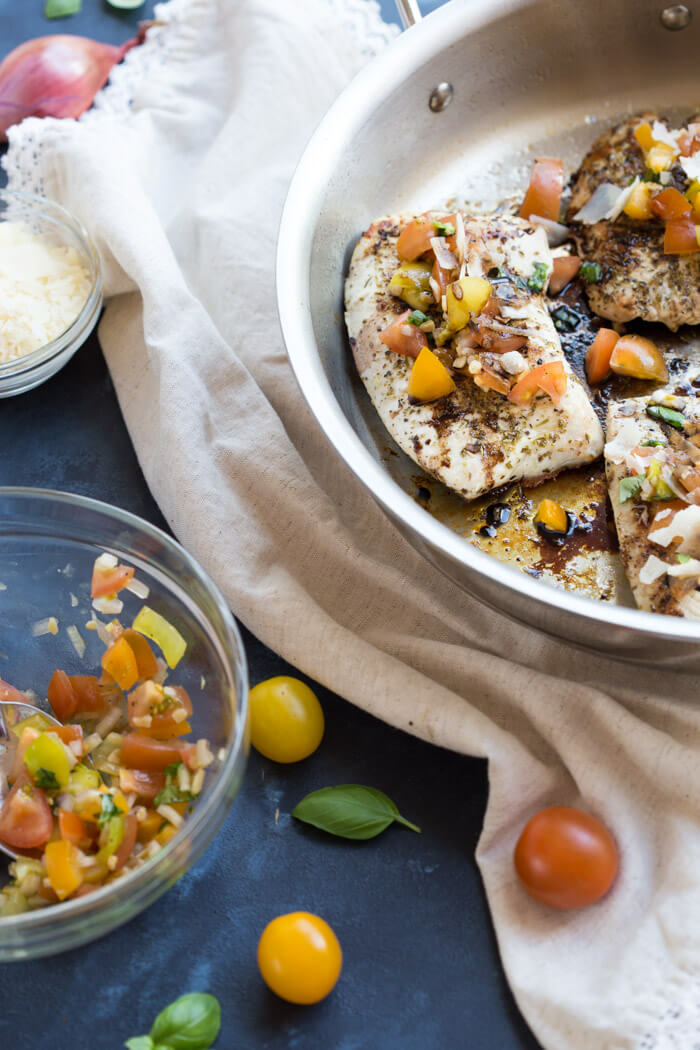 Italian herbed browned turkey breast served bruschetta-style sans bread with fresh basil, heirloom tomatoes, and a drizzle of tangy balsamic. Skillet Italian Herb Bruschetta Turkey is easy to cook and has so much flavor!