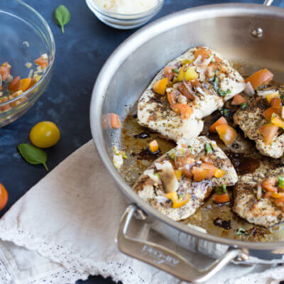 Italian herbed browned turkey breast served bruschetta-style sans bread with fresh basil, heirloom tomatoes, and a drizzle of tangy balsamic. Skillet Italian Herb Bruschetta Turkey is easy to cook and has so much flavor!