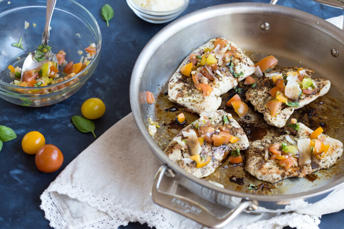 Italian herbed browned turkey breast served bruschetta-style sans bread with fresh basil, heirloom tomatoes, and a drizzle of tangy balsamic. Skillet Italian Herb Bruschetta Turkey is easy to cook and has so much flavor!