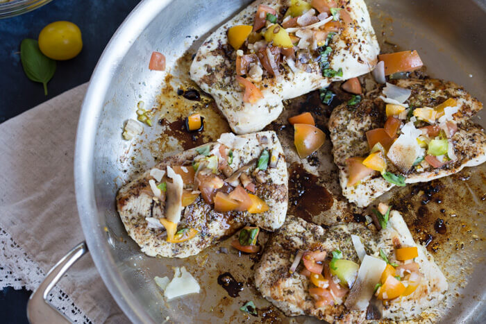 Italian herbed browned turkey breast served bruschetta-style sans bread with fresh basil, heirloom tomatoes, and a drizzle of tangy balsamic. Skillet Italian Herb Bruschetta Turkey is easy to cook and has so much flavor!