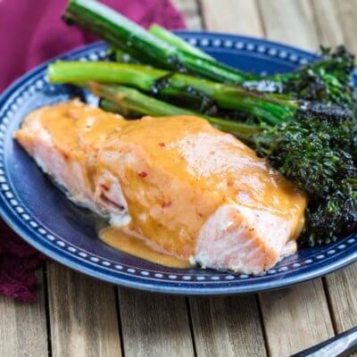 Easy Baked Salmon with Spicy Peanut Butter Glaze-- a zesty, citrusy, peanut butter glaze that takes salmon to the next level.