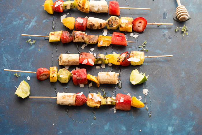 Add a punch of color to the barbecue with these Honey Lime Grilled Fruit Skewers. Tangy, sweet and hydrating on a hot summer day!