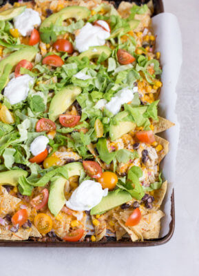 Love all the foods with tortilla chips and avocado... so naturally, Sheet Pan Chicken Nachos is a family favorite. It's one of those weeknight meals that we keep on rotation.