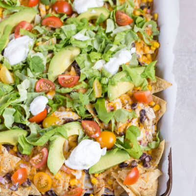 Love all the foods with tortilla chips and avocado... so naturally, Sheet Pan Chicken Nachos is a family favorite. It's one of those weeknight meals that we keep on rotation.