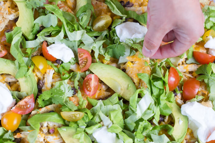 Love all the foods with tortilla chips and avocado... so naturally, Sheet Pan Chicken Nachos is a family favorite. It's one of those weeknight meals that we keep on rotation. 